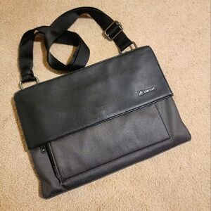 Sherpani Viso Crossbody Bag in Black and Gray with a vibrant Yellow Interior